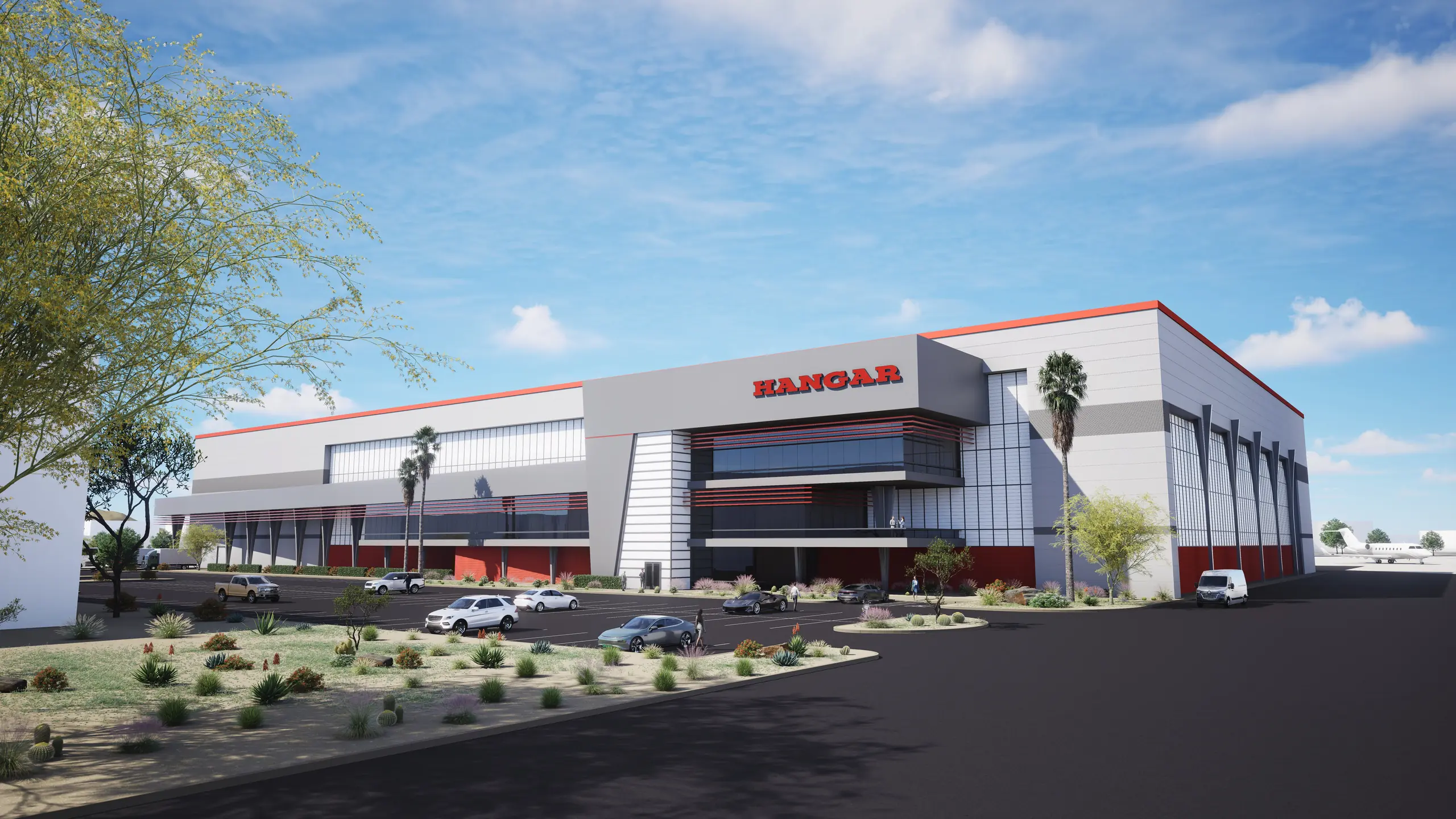Architectural rendering of a modern grey and white hangar building with red accents, desert landscaping, parked cars, and a private jet on the tarmac.